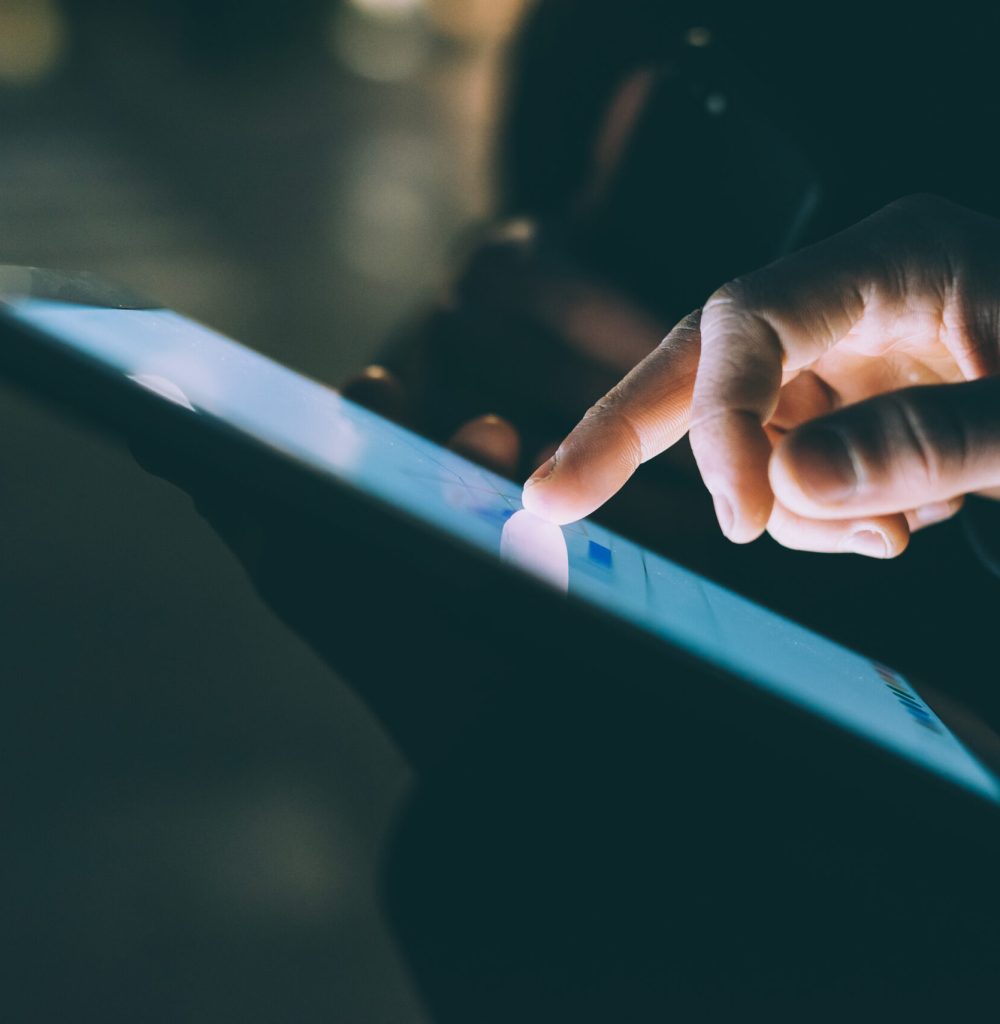 Close up man hand using tablet