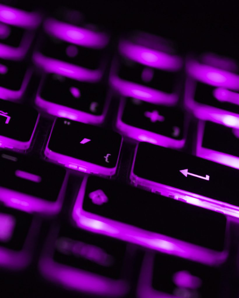 Colorful light keyboard for gaming. Backlit keyboard with versatile color schemes. Light purple